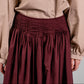 Women's pleated cotton maxi skirt in lightweight breathable fabric, modest summer fashion in burgundy